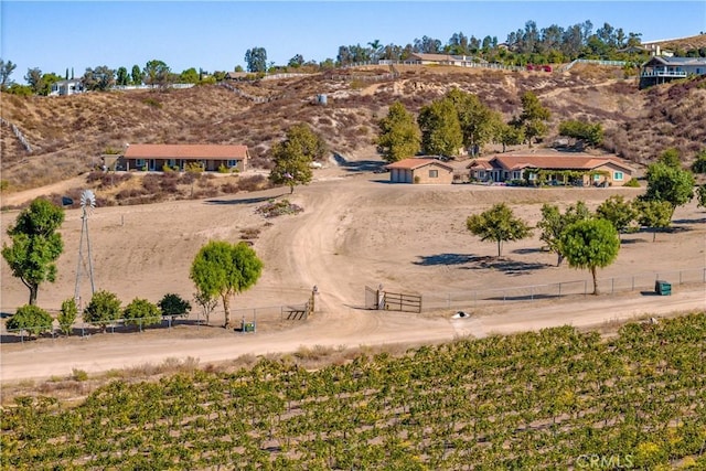 birds eye view of property featuring a rural view and a mountain view