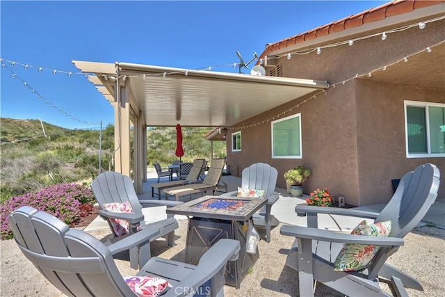 view of patio / terrace with a fire pit