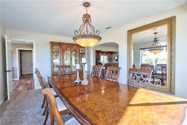 view of carpeted dining area