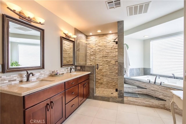 bathroom featuring tile patterned floors, vanity, and separate shower and tub