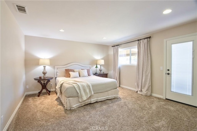 bedroom featuring light colored carpet