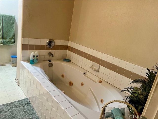 bathroom featuring a relaxing tiled tub and tile patterned floors