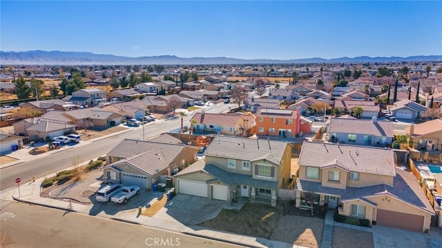 birds eye view of property featuring a mountain view