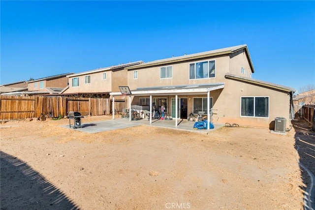 back of property with a patio and central air condition unit