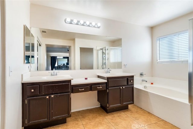 bathroom featuring tile patterned flooring, vanity, and separate shower and tub