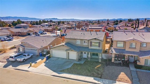 birds eye view of property featuring a mountain view