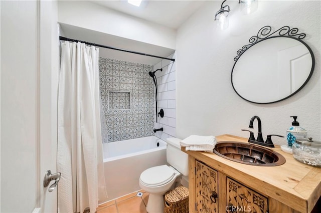 full bathroom featuring toilet, vanity, tile patterned flooring, and shower / bath combo