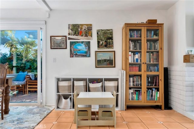 living area featuring light tile patterned floors