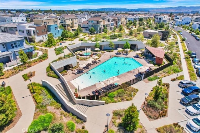 birds eye view of property featuring a mountain view