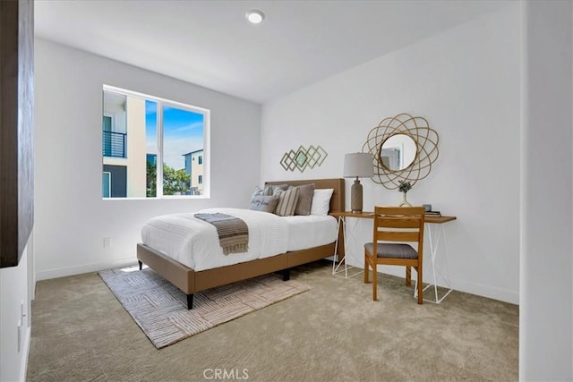bedroom with light colored carpet