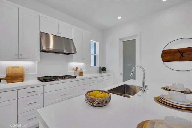 kitchen with sink, white cabinetry, and stainless steel gas stovetop