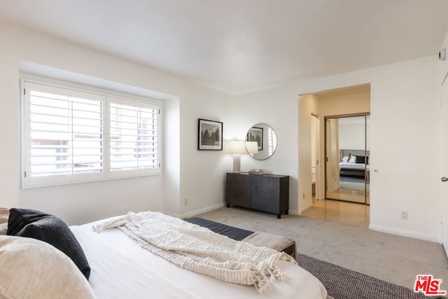 bedroom featuring light colored carpet