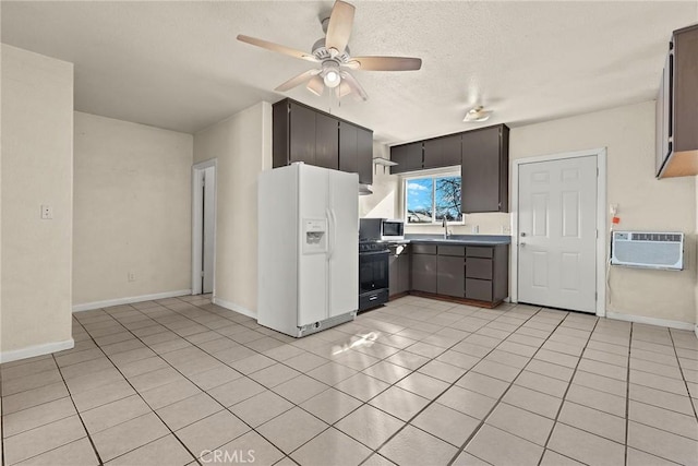 kitchen with light tile patterned floors, a wall mounted AC, white fridge with ice dispenser, range, and sink