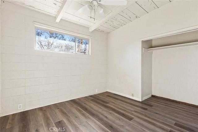 unfurnished bedroom featuring ceiling fan, a closet, dark hardwood / wood-style floors, and wooden ceiling