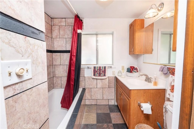 full bathroom featuring toilet, vanity, and shower / bath combo