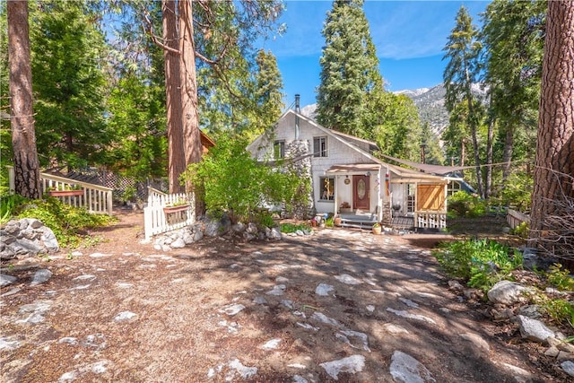 back of house with a mountain view