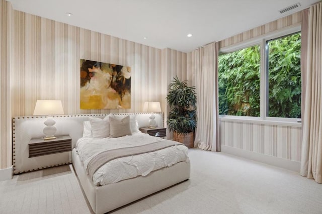 bedroom featuring light colored carpet