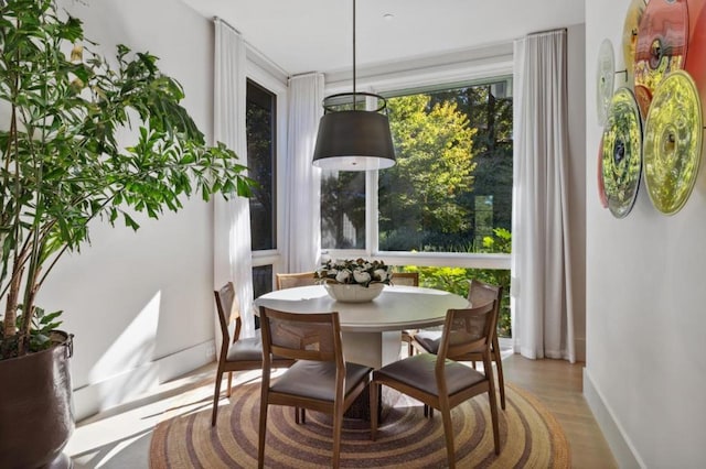 dining area with wood-type flooring