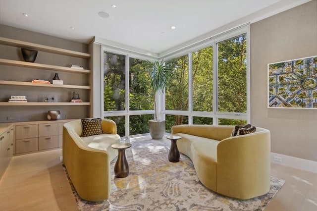 living area featuring built in shelves