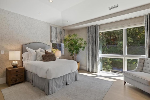 bedroom featuring a raised ceiling