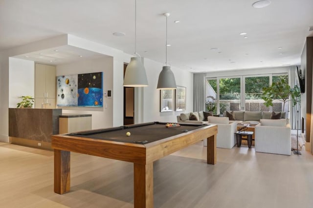 recreation room featuring a wall of windows, light hardwood / wood-style flooring, and billiards