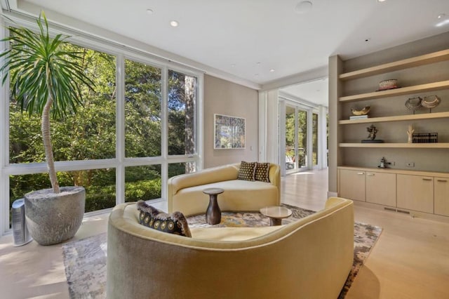 interior space with a wall of windows and a wealth of natural light