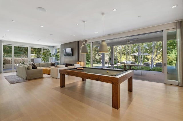 rec room with light wood-type flooring, pool table, and french doors