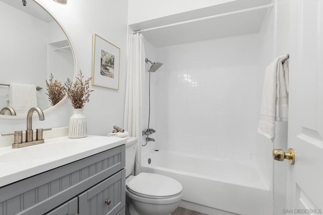 full bathroom featuring toilet, vanity, and shower / bathtub combination with curtain