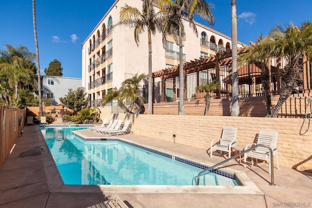 view of swimming pool featuring a pergola and a patio area