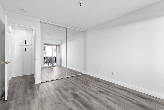 unfurnished room featuring dark hardwood / wood-style floors