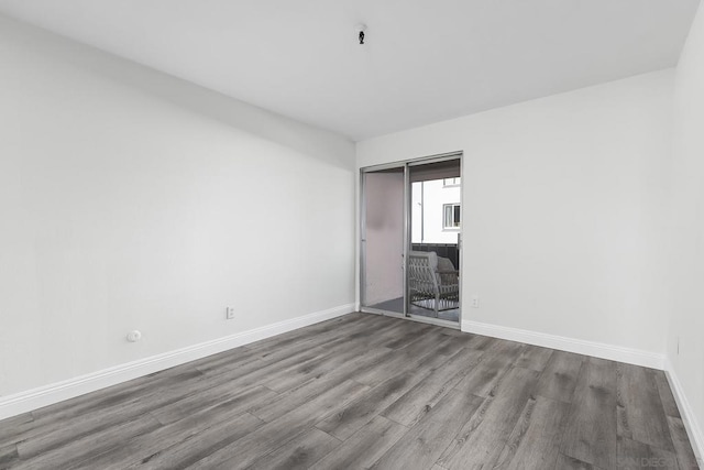 unfurnished bedroom featuring hardwood / wood-style floors and a closet