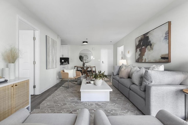 living room with dark hardwood / wood-style flooring