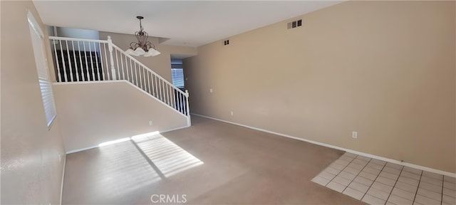 interior space with carpet floors and a notable chandelier