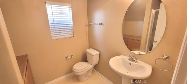 bathroom featuring toilet and sink