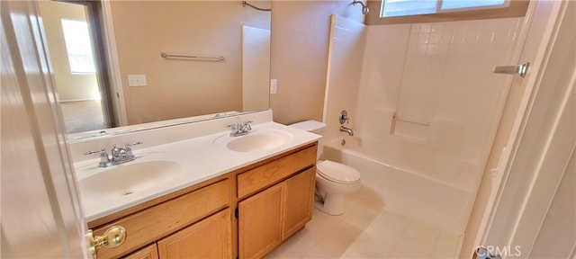 full bathroom featuring toilet, vanity, and  shower combination