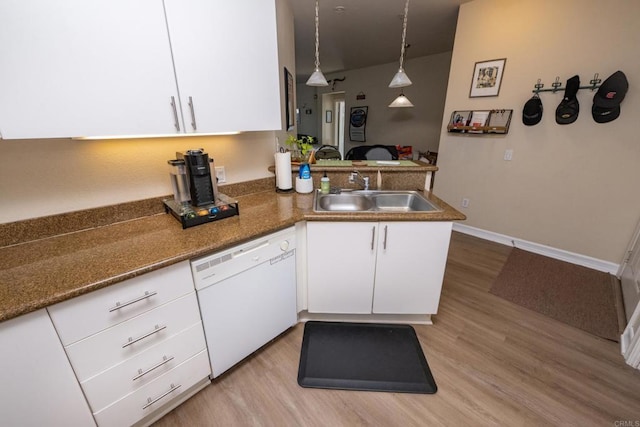 kitchen with white cabinetry, kitchen peninsula, white dishwasher, pendant lighting, and sink