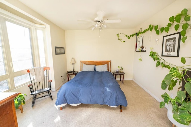 bedroom featuring ceiling fan and carpet