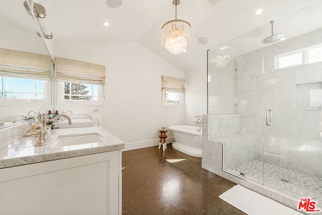 bathroom featuring shower with separate bathtub, an inviting chandelier, vanity, and vaulted ceiling