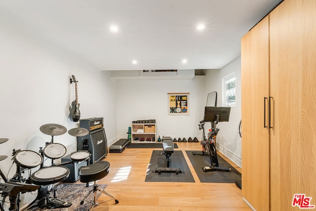 exercise area featuring light hardwood / wood-style flooring