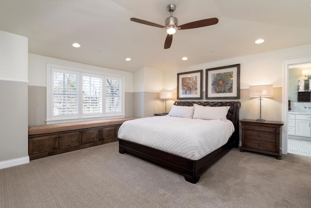 carpeted bedroom featuring connected bathroom and ceiling fan