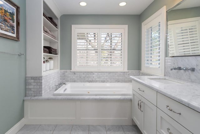 bathroom with vanity, a bath, and tile patterned floors