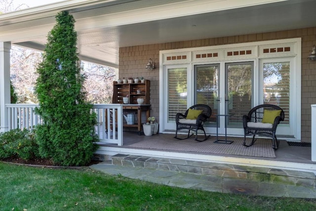 entrance to property featuring covered porch