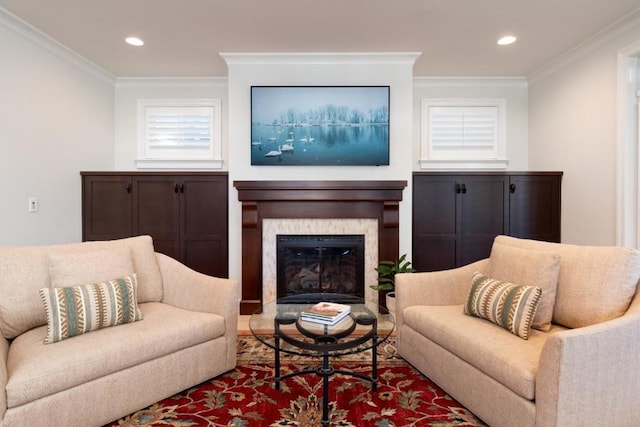 living room with crown molding and a high end fireplace