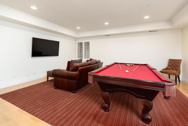 recreation room featuring crown molding, pool table, and a tray ceiling