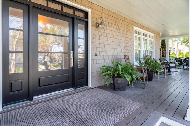 doorway to property with a porch