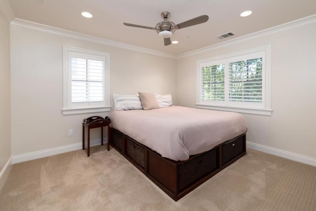 bedroom featuring ceiling fan, light colored carpet, and ornamental molding