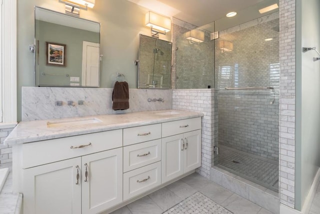 bathroom with vanity and a shower with shower door