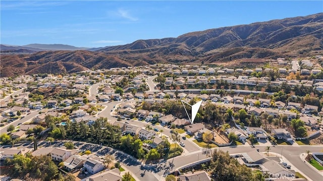 birds eye view of property with a mountain view