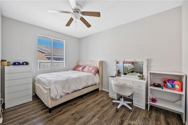 bedroom featuring ceiling fan and dark hardwood / wood-style floors