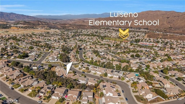 birds eye view of property featuring a mountain view